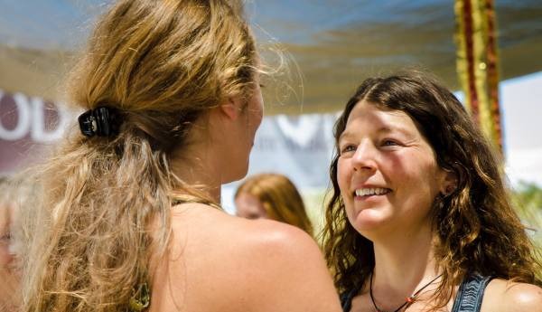 Jennica in warm conversation with a client outdoors