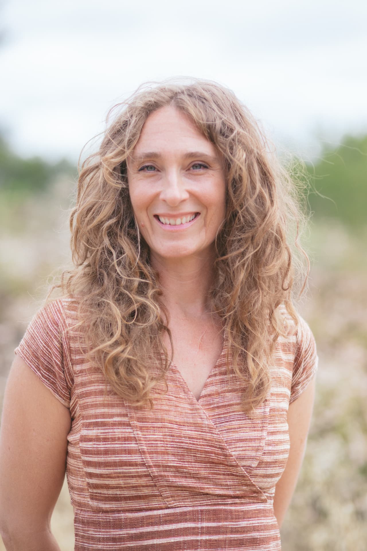 Jennica Mills smiling outdoors